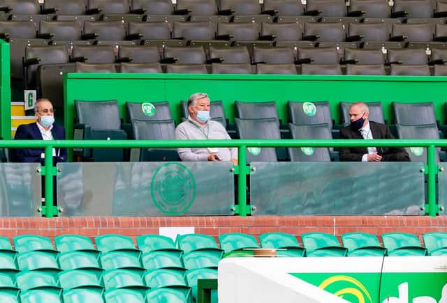 Celtic chief executive Peter Lawwell, pictured (centre) watching the behind closed doors friendly between his club and Ross County last weekend, has welcomed news fans could be allowed back inside stadiums from 14 September.