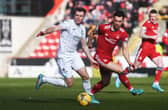 Chris Cadden is shadowed by Connor McLennan during Hibs' 2-1 defeat at Aberdeen. (Photo by Craig Foy / SNS Group)
