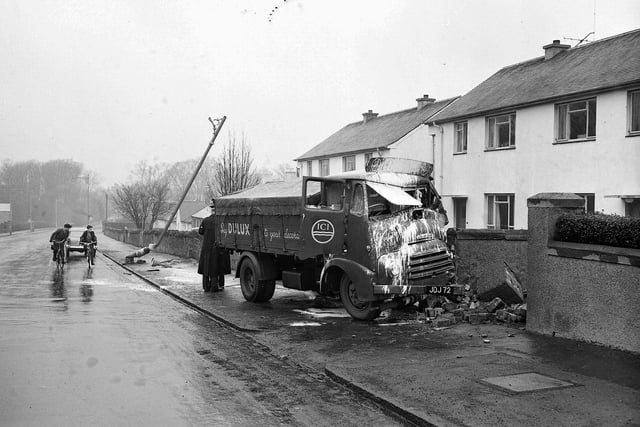 A lorry is seen crashed into a wall after an accident on Gilmerton Road in 1960.