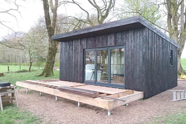 One of the cabins being built on the family’s seven acres of land, next to Galloway Forest Park.