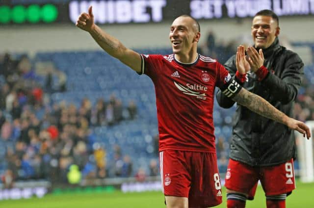 Aberdeen captain Scott Brown celebrates after his team's 2-2 draw against Rangers at Ibrox. (Photo by Alan Harvey / SNS Group)