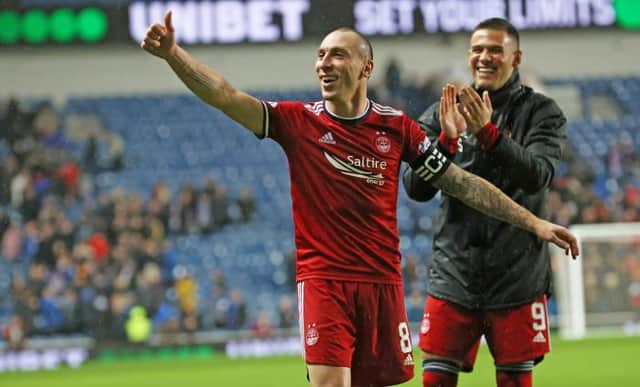 Aberdeen captain Scott Brown celebrates after his team's 2-2 draw against Rangers at Ibrox. (Photo by Alan Harvey / SNS Group)