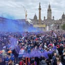 Rangers fans celebrate winning the Scottish Premiership title at George Square