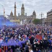 Rangers fans celebrate winning the Scottish Premiership title at George Square