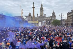 Rangers fans celebrate winning the Scottish Premiership title at George Square
