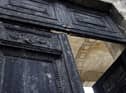 The burnt door of Bordeaux's city hall, is pictured the day after it was set on fire by demonstrators during a rally against pension reform.