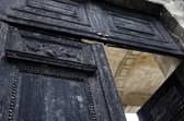 The burnt door of Bordeaux's city hall, is pictured the day after it was set on fire by demonstrators during a rally against pension reform.