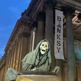 The artist's life size scythe-wielding Grim Reaper outside the Gallery of Modern Art in Glasgow. Picture: BANKSY.CO.UK/PA Wire