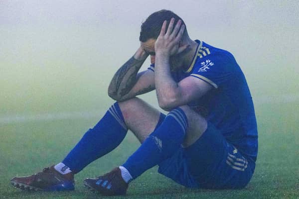 Cove's Scott Ross dejection says it all after they were relegated after losing to ten-man Morton.