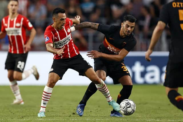 PSV's Israeli forward Eran Zahavi fights for the ball with Galatasaray's Turkish midfielder Aytac Kara (Photo by MAURICE VAN STEEN/ANP/AFP via Getty Images)