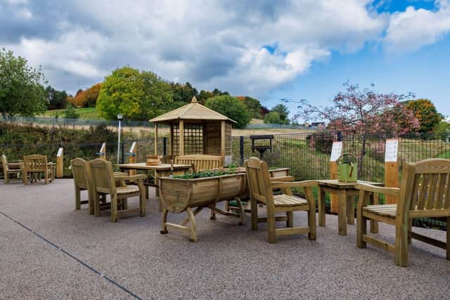 Staff and patient using new sensory garden