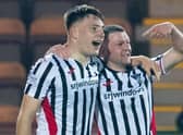 Dunfermline's Josh Edwards celebrates with Dom Thomas after making it 3-1 against Partick.  (Photo by Ross Parker / SNS Group)