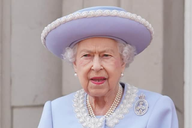 Queen Elizabeth II and the Duke of Kent watch from the balcony during the Trooping the Colour ceremony at Horse Guards Parade, central London, as the Queen celebrates her official birthday, on day one of the Platinum Jubilee celebrations.