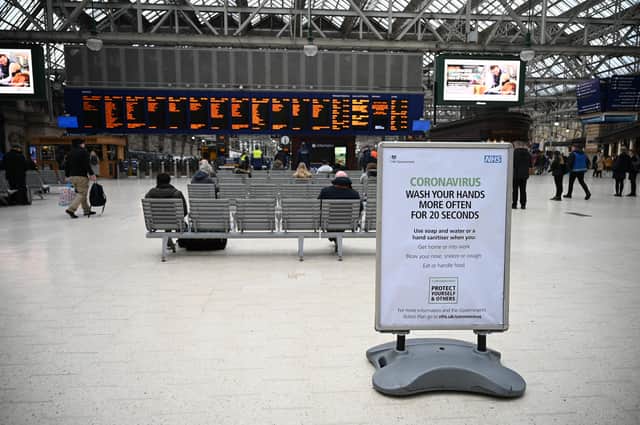 Commuters make their way through Glasgow Central station as passenger numbers dwindle.