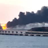 Thick black smoke rising from a fire on the Kerch bridge that links Crimea to Russia