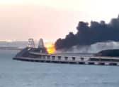 Thick black smoke rising from a fire on the Kerch bridge that links Crimea to Russia