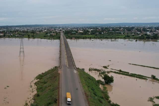 A truck carries local residents while driving to safer ground last month away from the rising waters in Numan Community of Adamawa State in North East Nigeria.