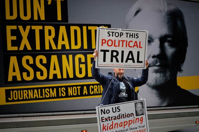 A protester makes a point outside Julian Assange’s controversial extradition hearing at London’s Old Bailey (Picture: Tolga Akmen/AFP via Getty Images)