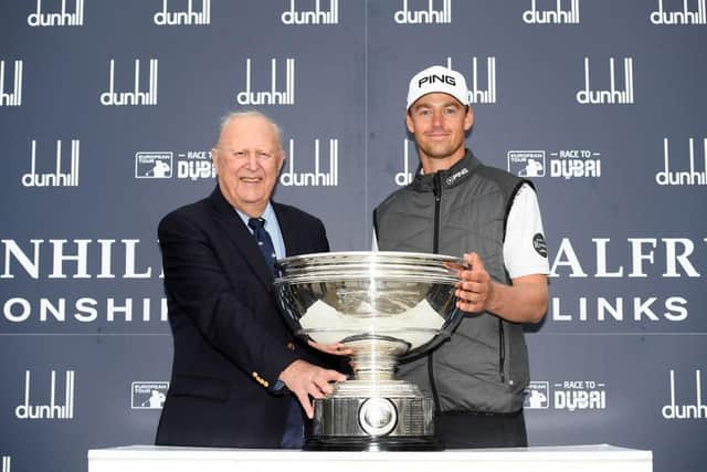 Sir Michael Bonallack presents Victor Perez with the trophy after the Frenchman's win in the 2019 Alfred Dunhill Links Championship. Picture: Ross Kinnaird/Getty Images.