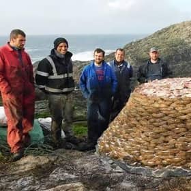 Guga hunters on Sula Sgeir with their haul of 2,000 salted young gannets