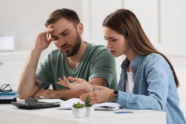 A young couple discussing their family budget at home. A new report has found 45 per cent of Scotland's wealth resides with 10 per cent of households. Picture: Getty Images
