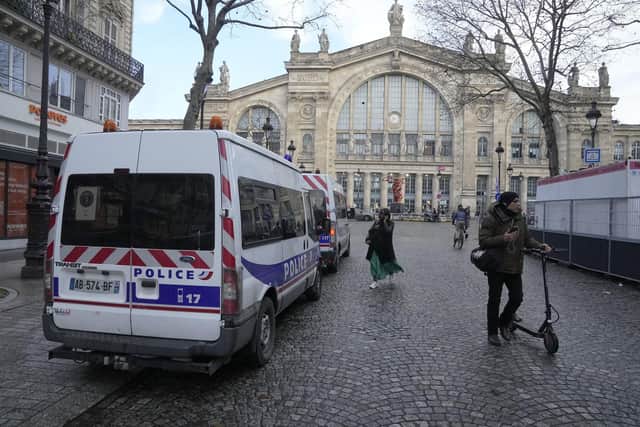 A police car parks outside the Gare du Nord train station, Wednesday, Jan. 11, 2023 in Paris. French media are reporting that people have been stabbed at a Paris train station and the interior minister says several people were injured before police "rapidly neutralized" the attacker. (AP Photo/Michel Euler)