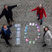 Gavin Keddie and Andrew McAllister, of The Wee Book Company, and councillors Mandy Watt and Kate Campbell celebrate the tenth anniversary of the Edinburgh Guarantee scheme as it is expanded to help people of all ages, as well as school leavers, find work or training (Picture: Lloyd Smith)