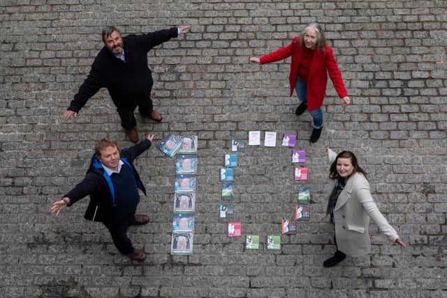 Gavin Keddie and Andrew McAllister, of The Wee Book Company, and councillors Mandy Watt and Kate Campbell celebrate the tenth anniversary of the Edinburgh Guarantee scheme as it is expanded to help people of all ages, as well as school leavers, find work or training (Picture: Lloyd Smith)