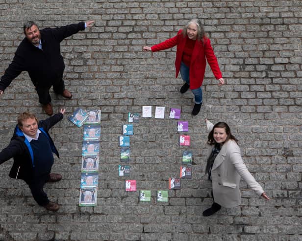 Gavin Keddie and Andrew McAllister, of The Wee Book Company, and councillors Mandy Watt and Kate Campbell celebrate the tenth anniversary of the Edinburgh Guarantee scheme as it is expanded to help people of all ages, as well as school leavers, find work or training (Picture: Lloyd Smith)