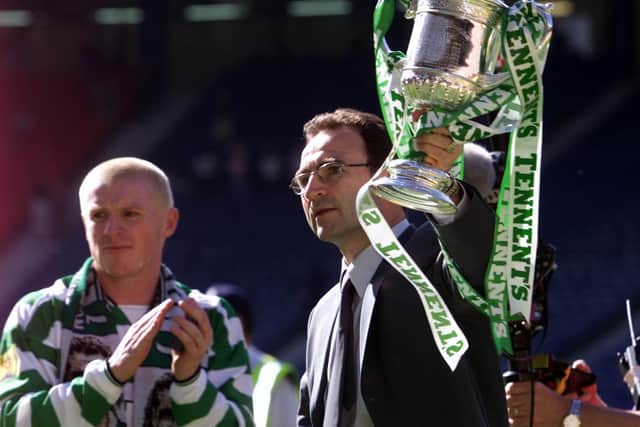 Neil Lennon celebrates with Martin O'Neill after Celtic clinched his playing treble in 2000-01. Now Sunday's Scottish Cup final gives Lennon the chance to become the first man to also claim a treble as a manager. (Photo by SNS Group).