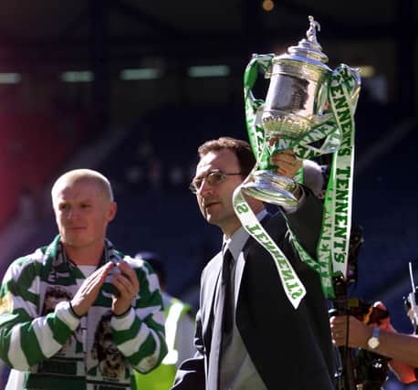 Neil Lennon celebrates with Martin O'Neill after Celtic clinched his playing treble in 2000-01. Now Sunday's Scottish Cup final gives Lennon the chance to become the first man to also claim a treble as a manager. (Photo by SNS Group).