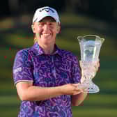 Gemma Dryburgh shows off her trophy after winning the TOTO Japan Classic last weekend. Yoshimasa Nakano/Getty Images.