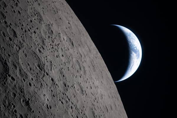 Earth sets behind the moon during a lunar flyby captured by the Artemis II crew . The world effort to put the Orion spacecraft mirrors global networks being forged from Scotland to devise the future of space.