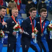 Great Britain's curlers Ross Whyte, Hammy McMillan, Bobby Lammie, Grant Hardie and Bruce Mouat with their silver medals.