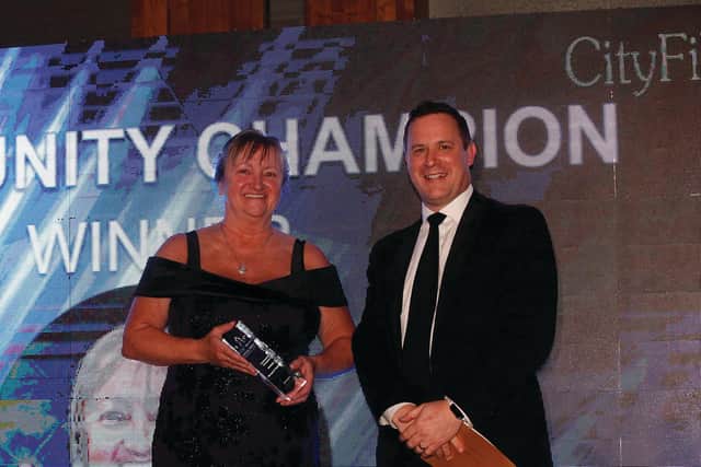 Margaret Pagliarulo receives the Community Champion award from Paul Wakefield of CityFibre