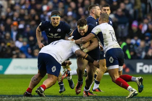 Scotland's Ewan Ashman (C) and France's Gael Fickou in action during last weekend's match at Murrayfield.