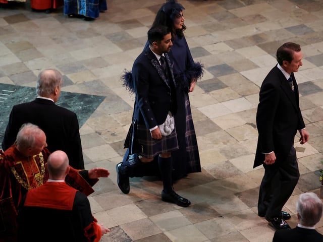 First Minister of Scotland Humza Yousaf and Nadia El-Nakla arriving ahead of the coronation of King Charles III and Queen Camilla at Westminster Abbey