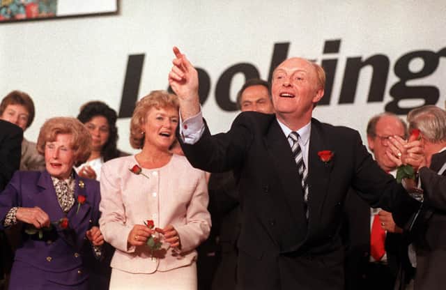 Neil Kinnock throws roses to delegates at the end of the Labour Party Conference in 1990 (Picture: Michael Stephens/PA)