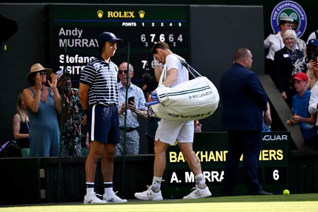 Andy Murray trudges off after his five-set defeat by Stefanos Tsitsipas at Wimbledon.