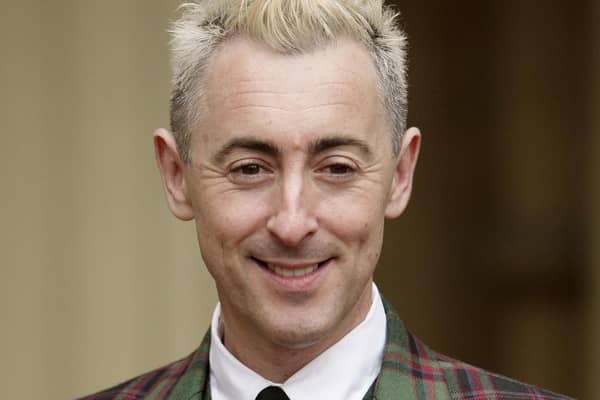 Alan Cumming wore tartan to pick up his OBE at Buckingham Palace in 2009. He decided to hand back the honour several months ago. Picture: Dominic Lipinski