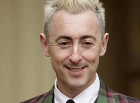 Alan Cumming wore tartan to pick up his OBE at Buckingham Palace in 2009. He decided to hand back the honour several months ago. Picture: Dominic Lipinski