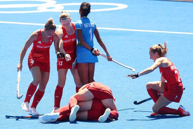 Sarah Robertson of celebrates scoring Britain's second goal with Shona McCallin, Susannah Townsend and Elena Sian Rayer during the Women's Bronze medal match against India. Picture: Alexander Hassenstein/Getty Images)