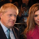 Prime Minister Boris Johnson with his partner Carrie Symonds, who are understood to be taking their son on a holiday to Scotland.  Picture: JEREMY SELWYN/POOL/AFP via Getty Images.