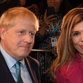 Prime Minister Boris Johnson with his partner Carrie Symonds, who are understood to be taking their son on a holiday to Scotland.  Picture: JEREMY SELWYN/POOL/AFP via Getty Images.