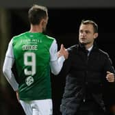 Shaun Maloney speaks to his Hibs striker Christian Doidge at full time.