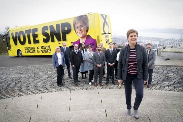 First Minister Nicola Sturgeon with candidates and party supporters at Dundee Law in Dundee at the launch for the SNP's campaign bus