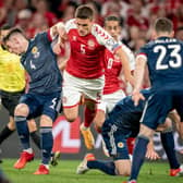 Denmark's Joakim Mahle (C) and Scotland's Billy Gilmour (L) vie for the ball during the 2022 FIFA World Cup qualifier group F football match between Denmark and Scotland at Parken Stadium in Copenhagen on September 1, 2021. (Photo by MADS CLAUS RASMUSSEN/Ritzau Scanpix/AFP via Getty Images)