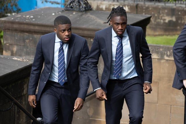 Rangers players Nnamdi Ofoborh (L) and Calvin Bassey arrive at the funeral of Rangers kitman Jimmy Bell