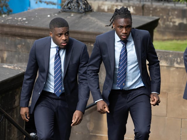Rangers players Nnamdi Ofoborh (L) and Calvin Bassey arrive at the funeral of Rangers kitman Jimmy Bell