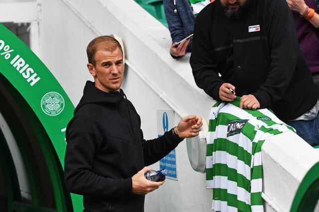 Joe Hart signs an autograph at Celtic Park when there for the Milner/Petrov match for cancer three years ago. Now a player at the Parkhead club, he says he knows from Fraser Forster's experience that, when all is going well, "there aren't many better places to play football". (Photo by Craig Williamson/SNS Group).